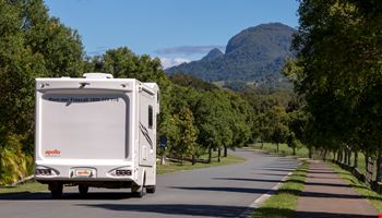 Euro Slider On The Road Back View - Motorhome Rental Hobart - Campervan Rental Shop