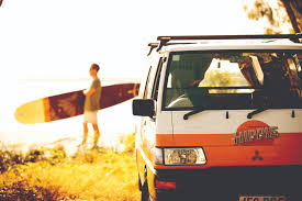Man Holding a Surf Board- Adelaide Hills campervan hire - Campervan Rental Shop