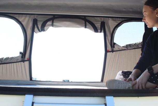 Woman Looking Outside - Camper Hire Broome - Campervan Rental Shop